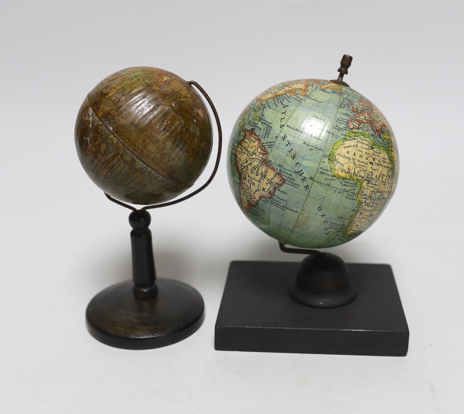 A small German globe on stand and another, tallest 16cm high